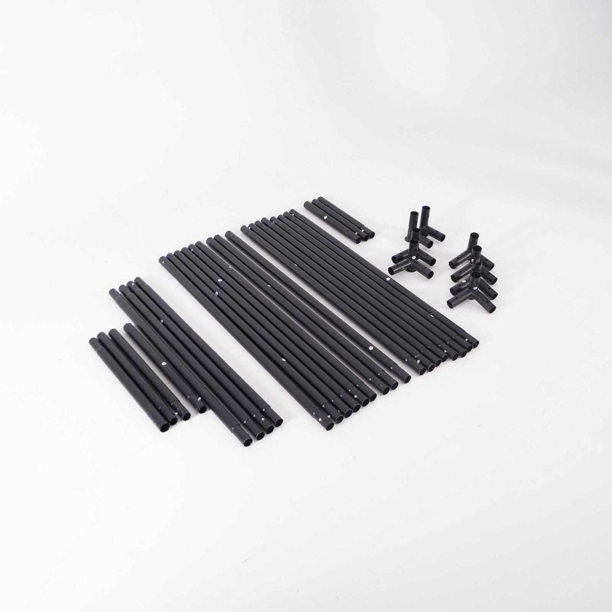 GolfBays EasySim Golf Simulator Enclosure with black metal support poles and plastic connector fittings arranged as a kit