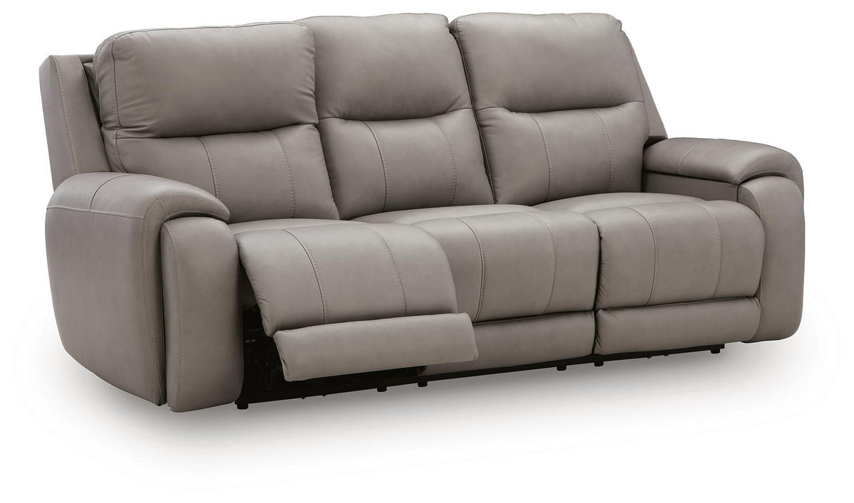 Real Moments power reclining sofa in ash gray leather with plush padded cushions, wide arms and extended footrests.