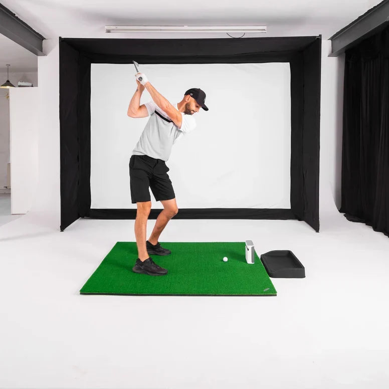 GolfBays EasySim Golf Simulator Enclosure with black fabric frame and white impact screen for indoor golf practice