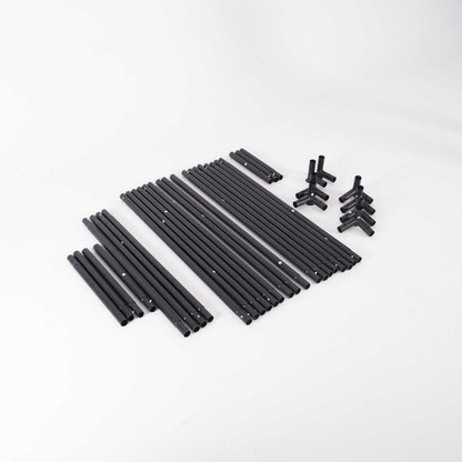 GolfBays EasySim Golf Simulator Enclosure with black metal support poles and plastic connector fittings arranged as a kit