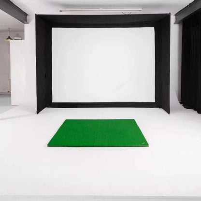 GolfBays EasySim Golf Simulator Enclosure with black fabric sides and top, white impact screen and green hitting mat