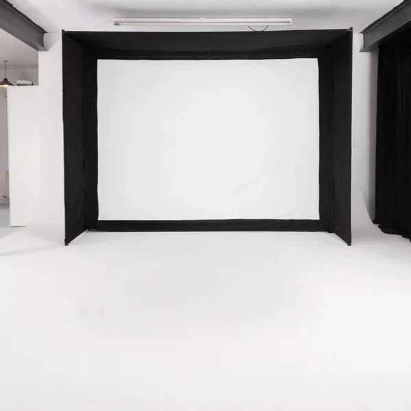 GolfBays EasySim Golf Simulator Enclosure with a white impact screen, black fabric sides and top, and a rectangular frame