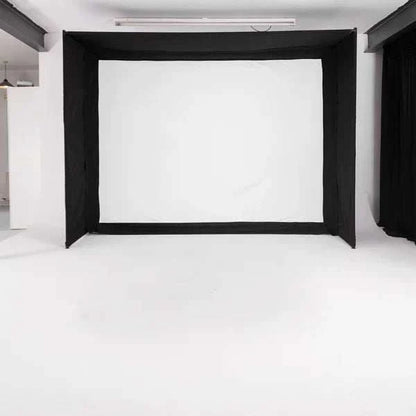 GolfBays EasySim Golf Simulator Enclosure with a white impact screen, black fabric sides and top, and a rectangular frame