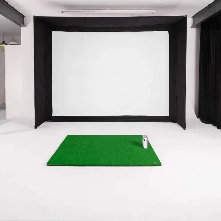 GolfBays EasySim Golf Simulator Enclosure with a white impact screen, black fabric sides and top, plus a green hitting mat.