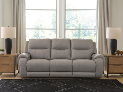 Real Moments power reclining sofa in ash gray leather with three cushioned seats, padded arms and adjustable headrests