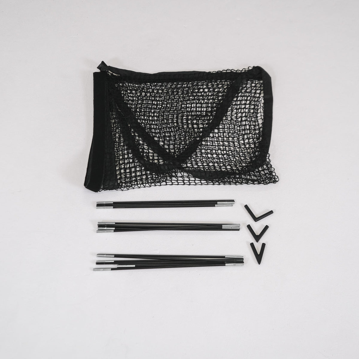 SimBox Golf Simulator Enclosure with black mesh side netting, silver metal support poles and black corner connectors